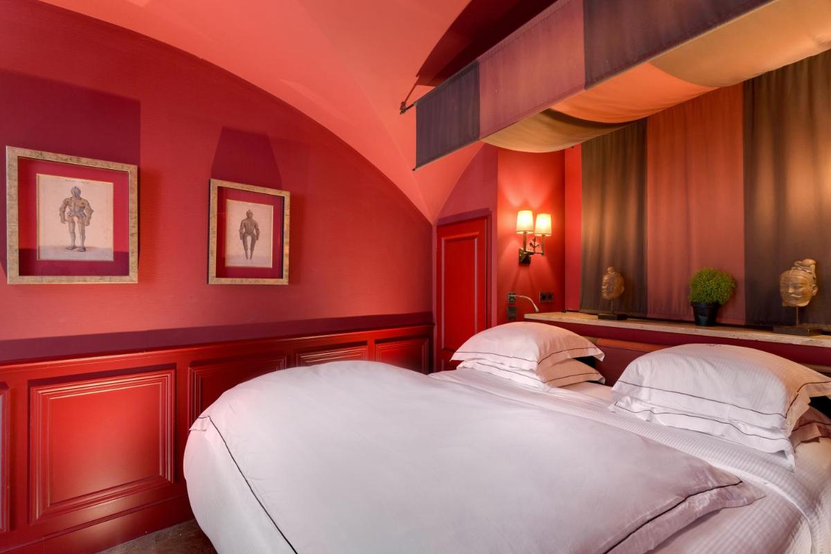 Un ou plusieurs lits dans un hébergement de l'établissement Hôtel du Château & Spa - Teritoria