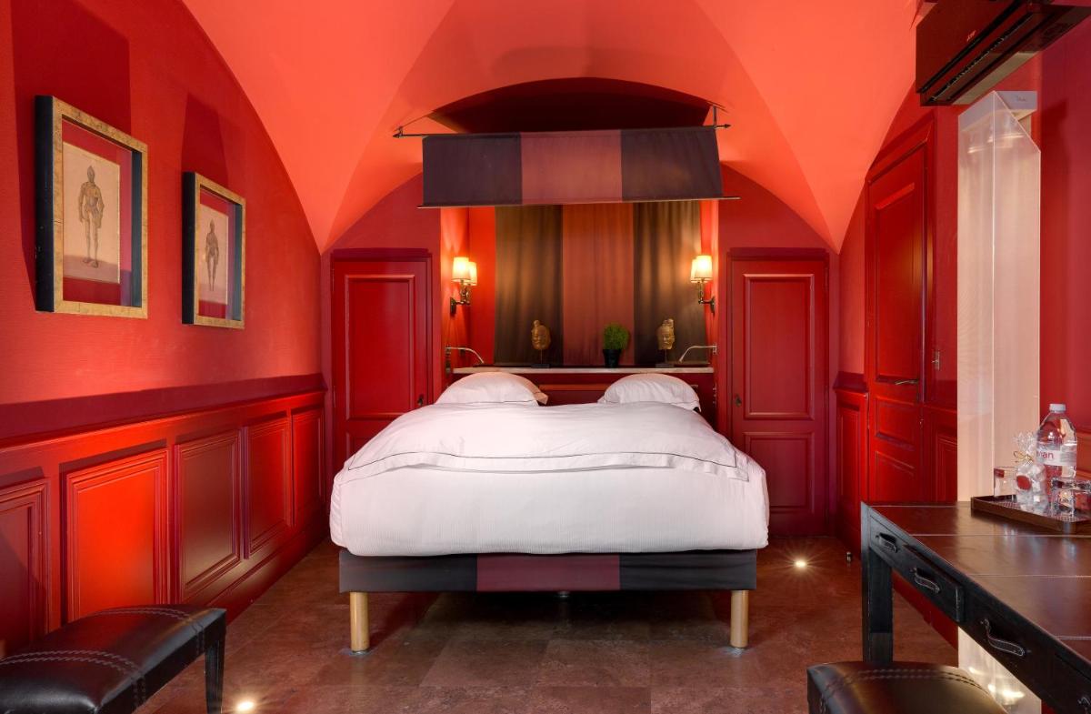 Un ou plusieurs lits dans un hébergement de l'établissement Hôtel du Château & Spa - Teritoria
