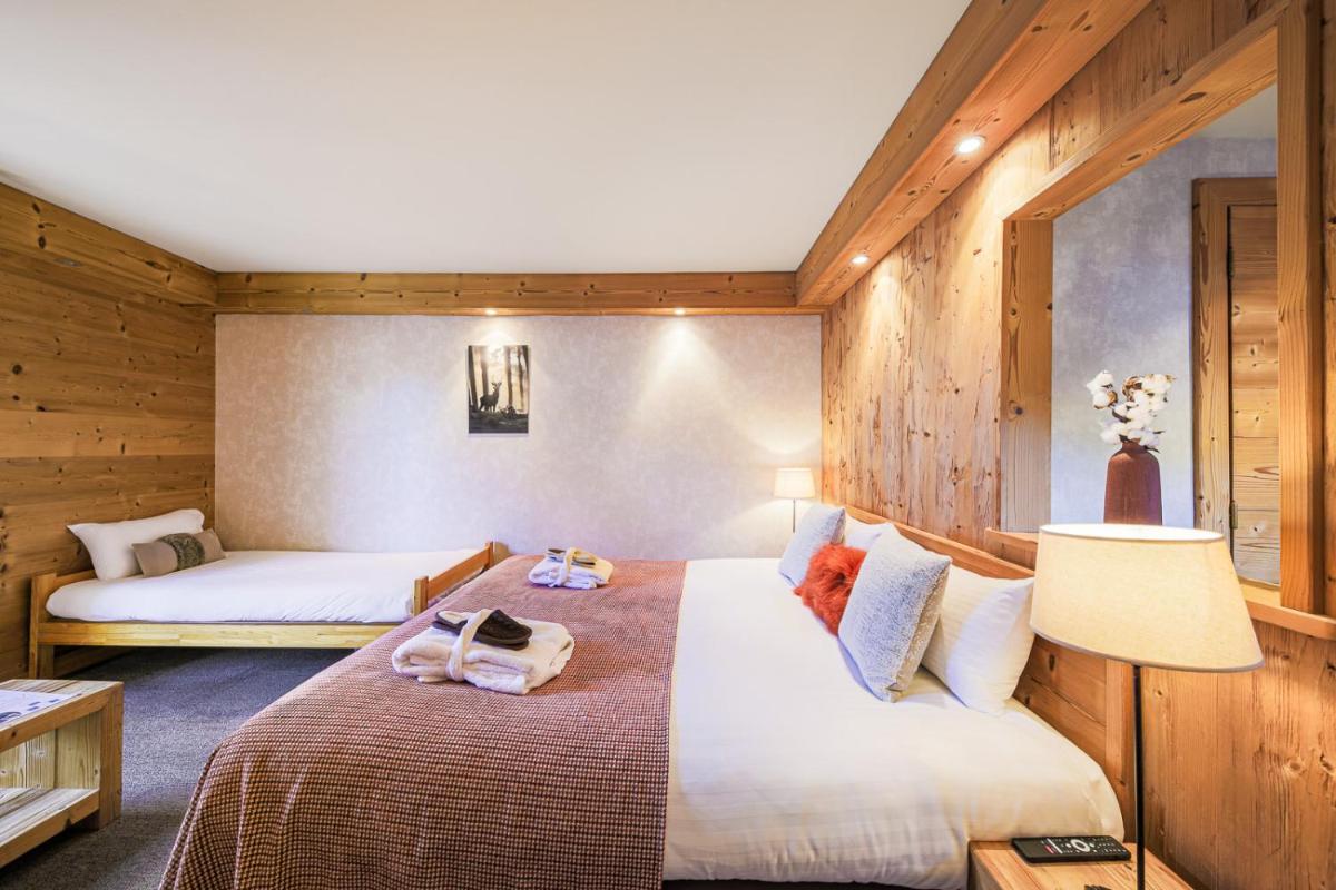 Un ou plusieurs lits dans un hébergement de l'établissement Hôtel et Spa les Clarines