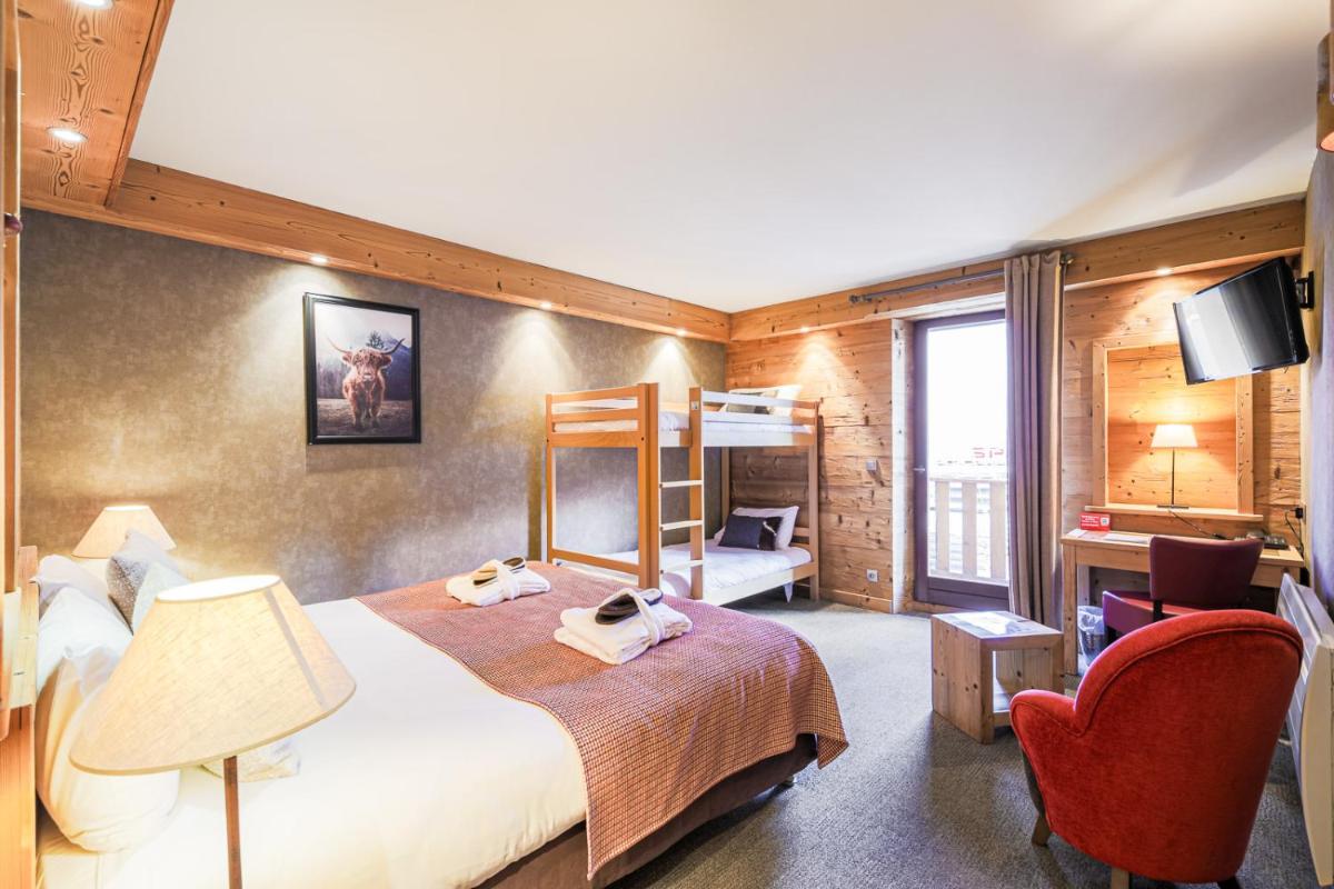 Un ou plusieurs lits dans un hébergement de l'établissement Hôtel et Spa les Clarines