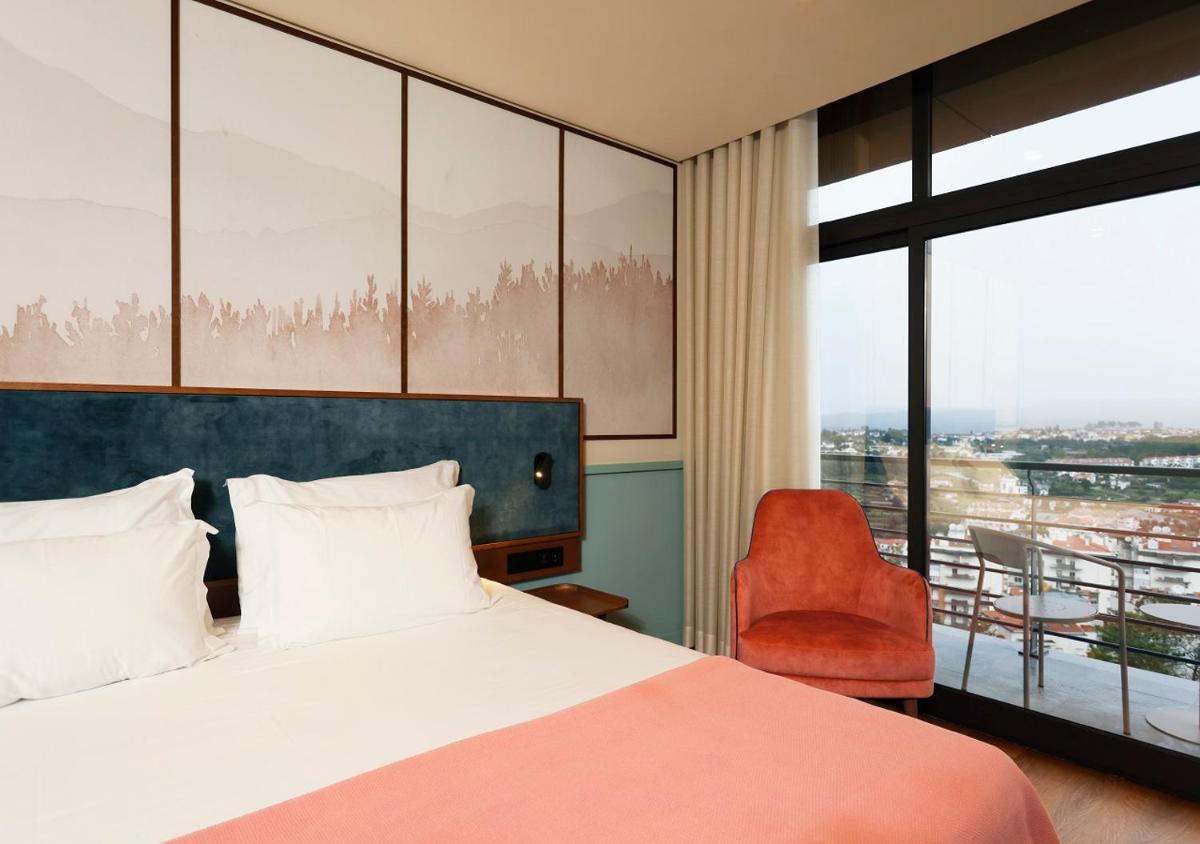 Uma cama ou camas num quarto em Montebelo Viseu Congress Hotel & Spa