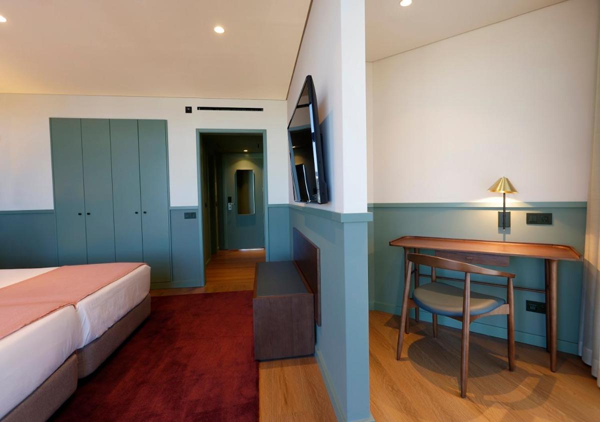 Uma cama ou camas num quarto em Montebelo Viseu Congress Hotel & Spa