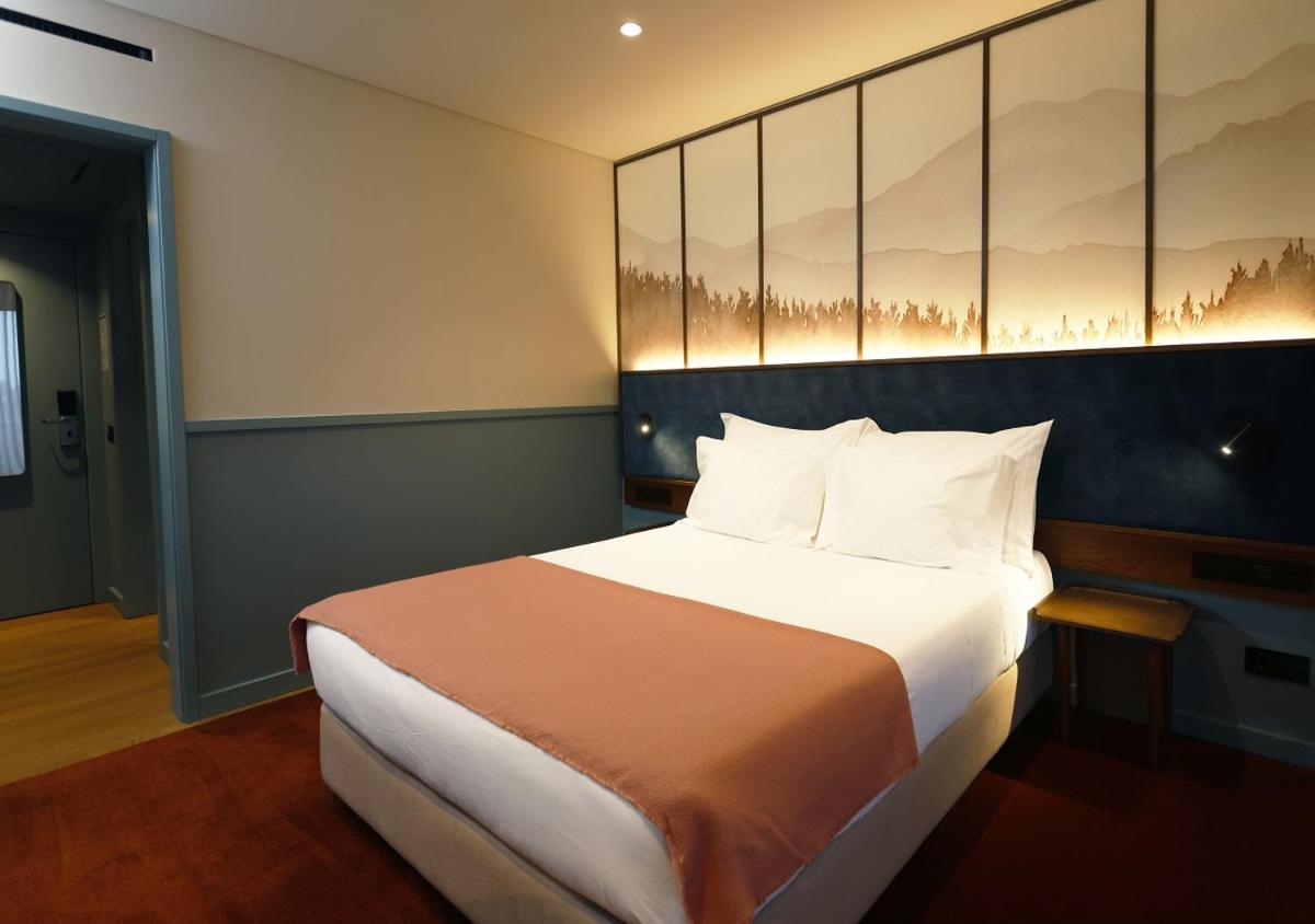 Uma cama ou camas num quarto em Montebelo Viseu Congress Hotel & Spa