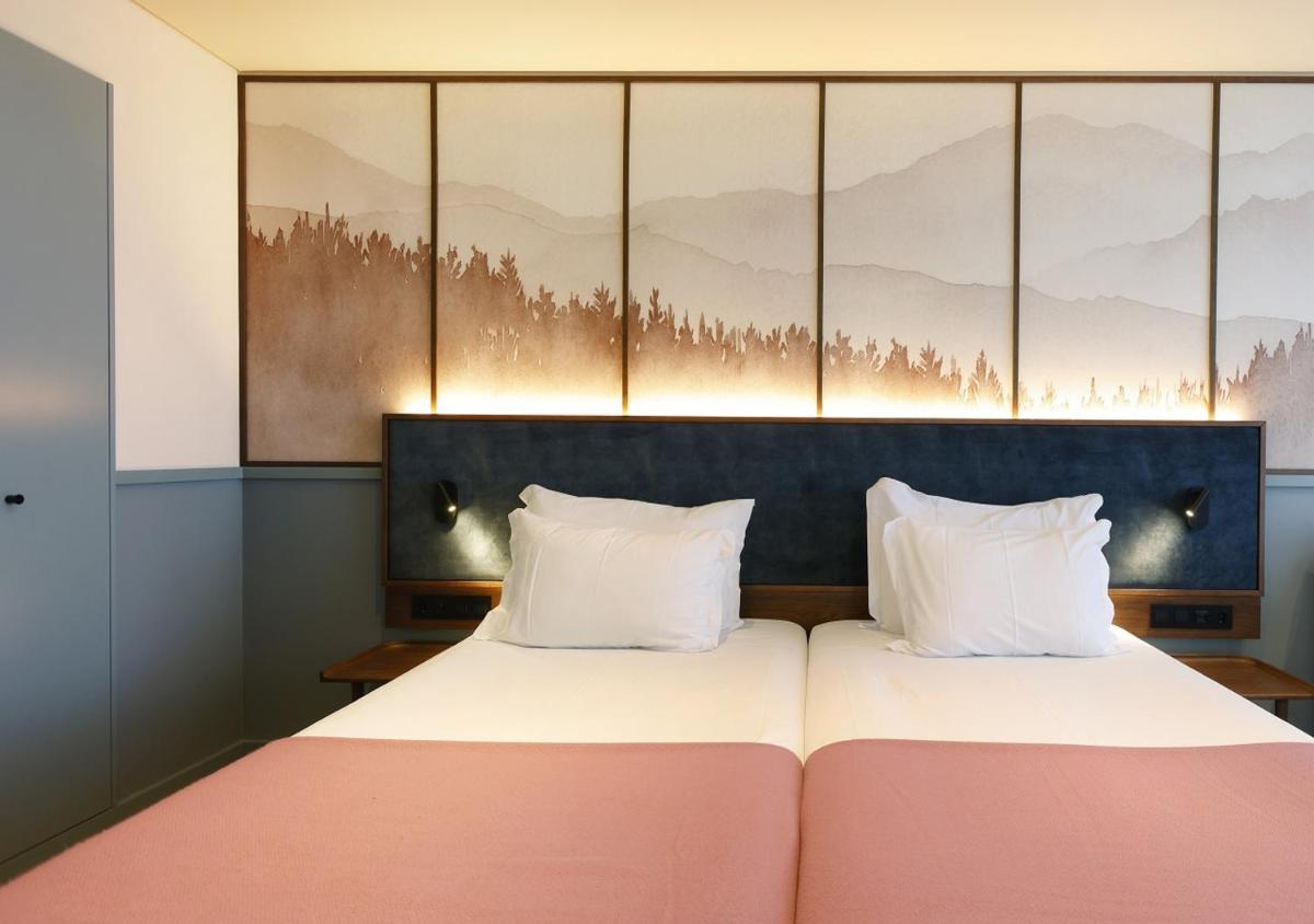 Uma cama ou camas num quarto em Montebelo Viseu Congress Hotel & Spa