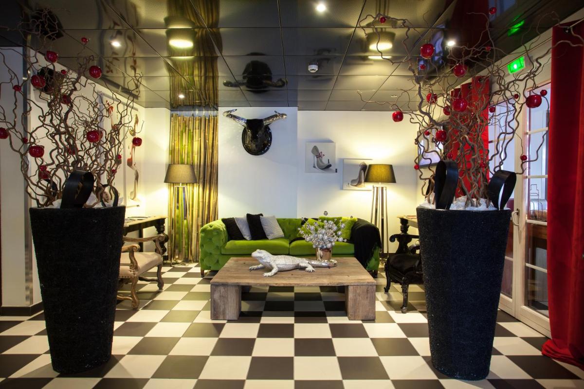 Coin salon dans l'établissement Auberge De Maison Rouge