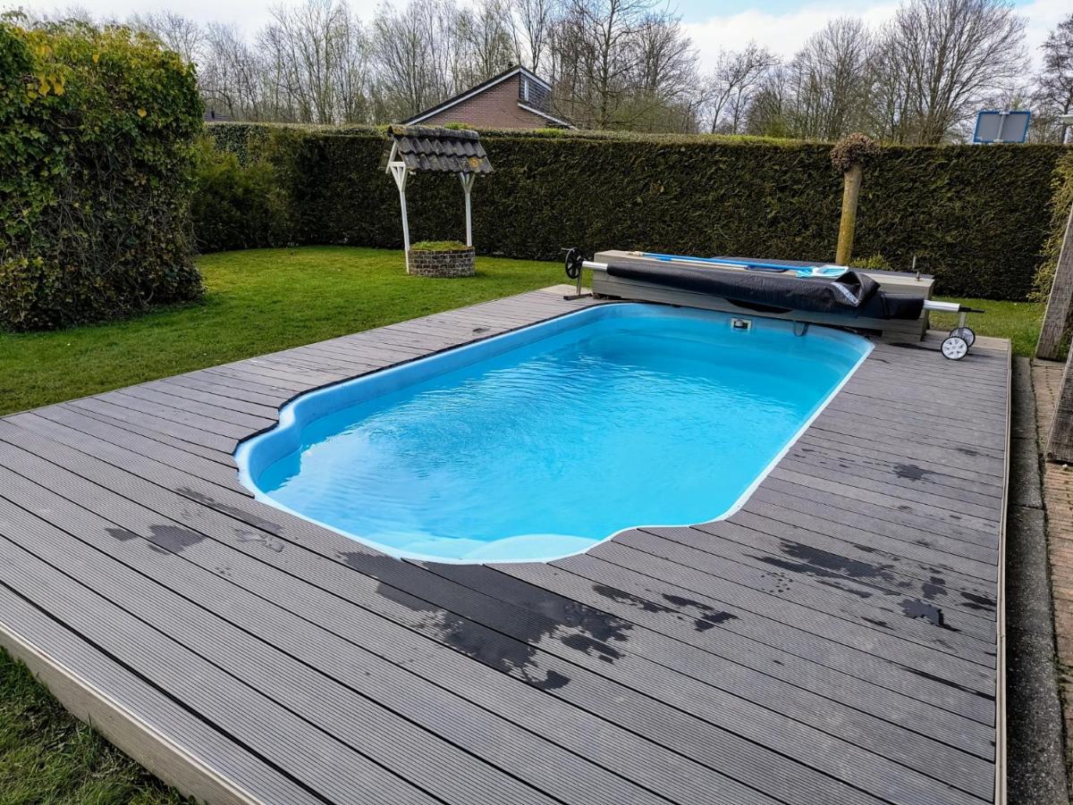 Gemütliches Ferienhaus mit beheiztem Pool, Garten und überdachter Terrasse - Housity