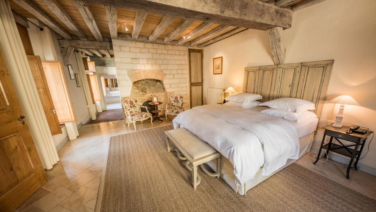 Un ou plusieurs lits dans un hébergement de l'établissement La Maison de Rhodes Hôtel & Spa