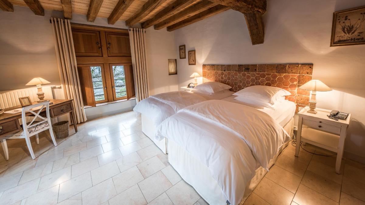 Un ou plusieurs lits dans un hébergement de l'établissement La Maison de Rhodes Hôtel & Spa
