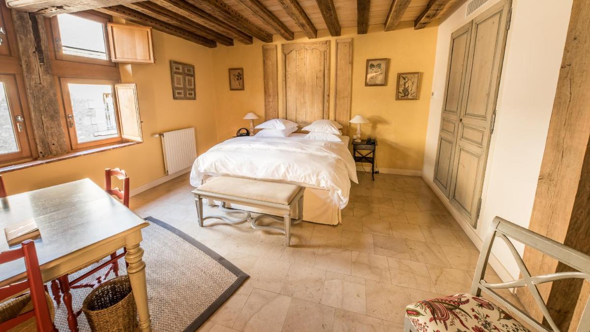 Un ou plusieurs lits dans un hébergement de l'établissement La Maison de Rhodes Hôtel & Spa