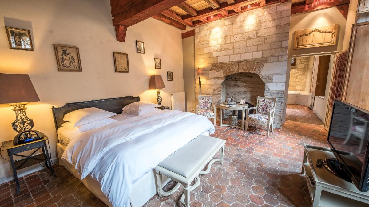 Un ou plusieurs lits dans un hébergement de l'établissement La Maison de Rhodes Hôtel & Spa
