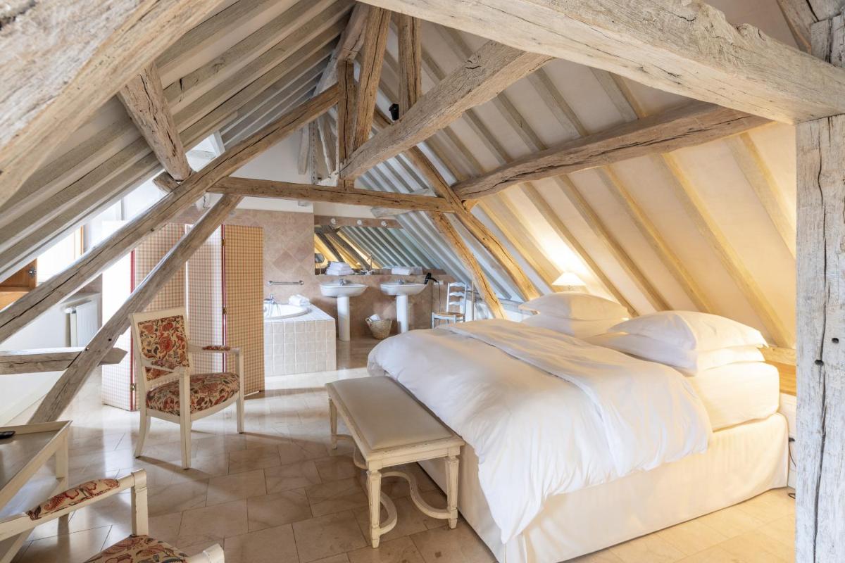 Un ou plusieurs lits dans un hébergement de l'établissement La Maison de Rhodes Hôtel & Spa