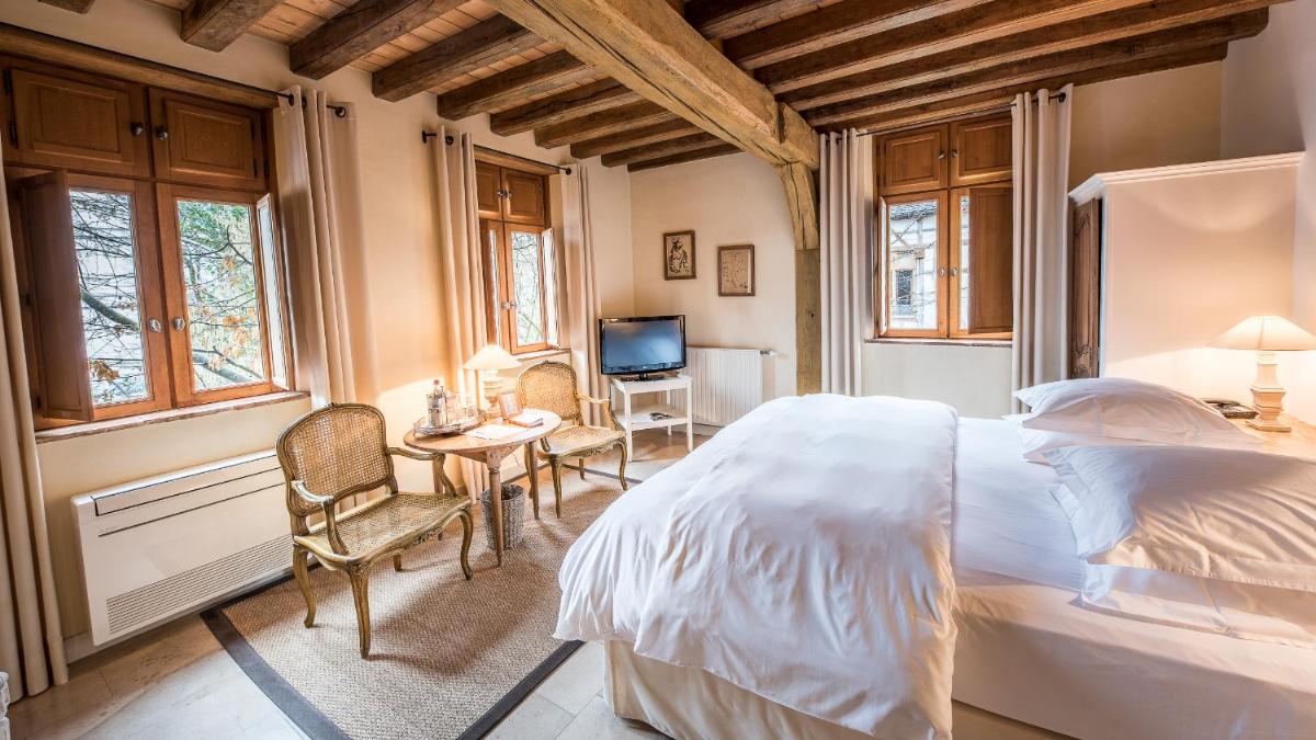 Un ou plusieurs lits dans un hébergement de l'établissement La Maison de Rhodes Hôtel & Spa
