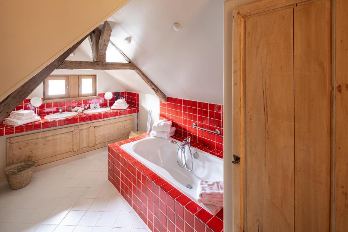 Un ou plusieurs lits dans un hébergement de l'établissement La Maison de Rhodes Hôtel & Spa
