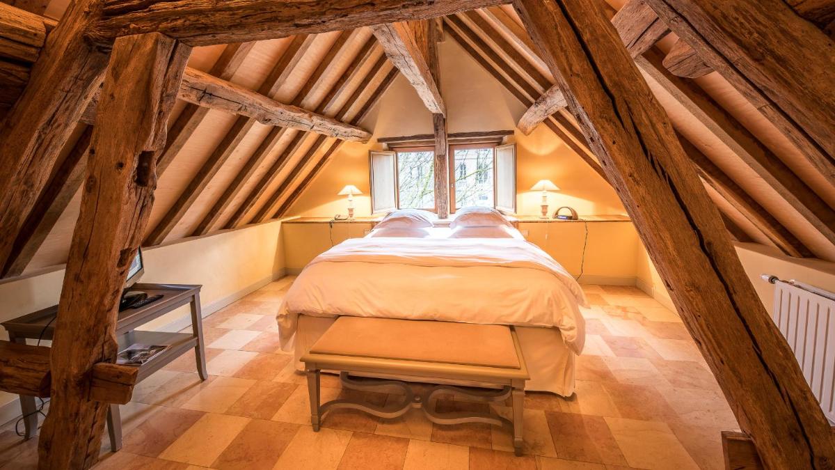 Un ou plusieurs lits dans un hébergement de l'établissement La Maison de Rhodes Hôtel & Spa
