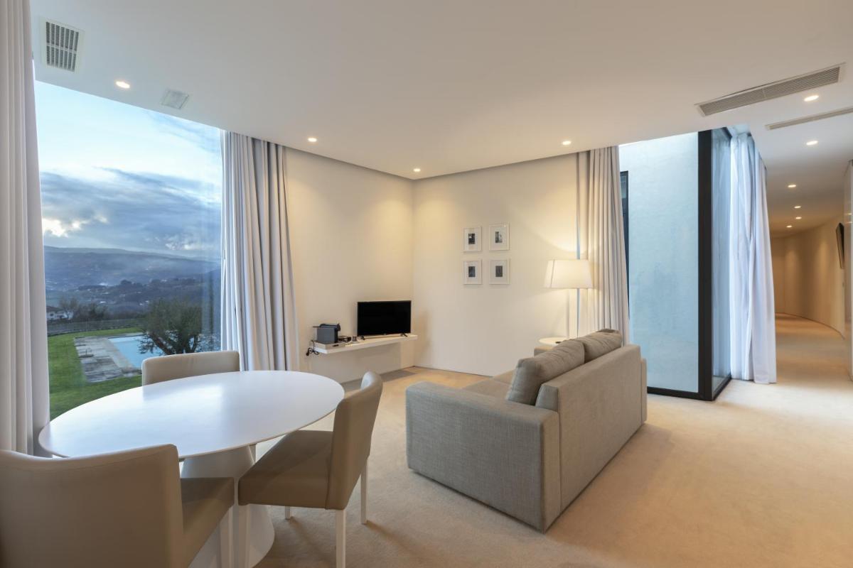 Uma televisão e/ou sistema de entretenimento em Tempus Hotel & Spa