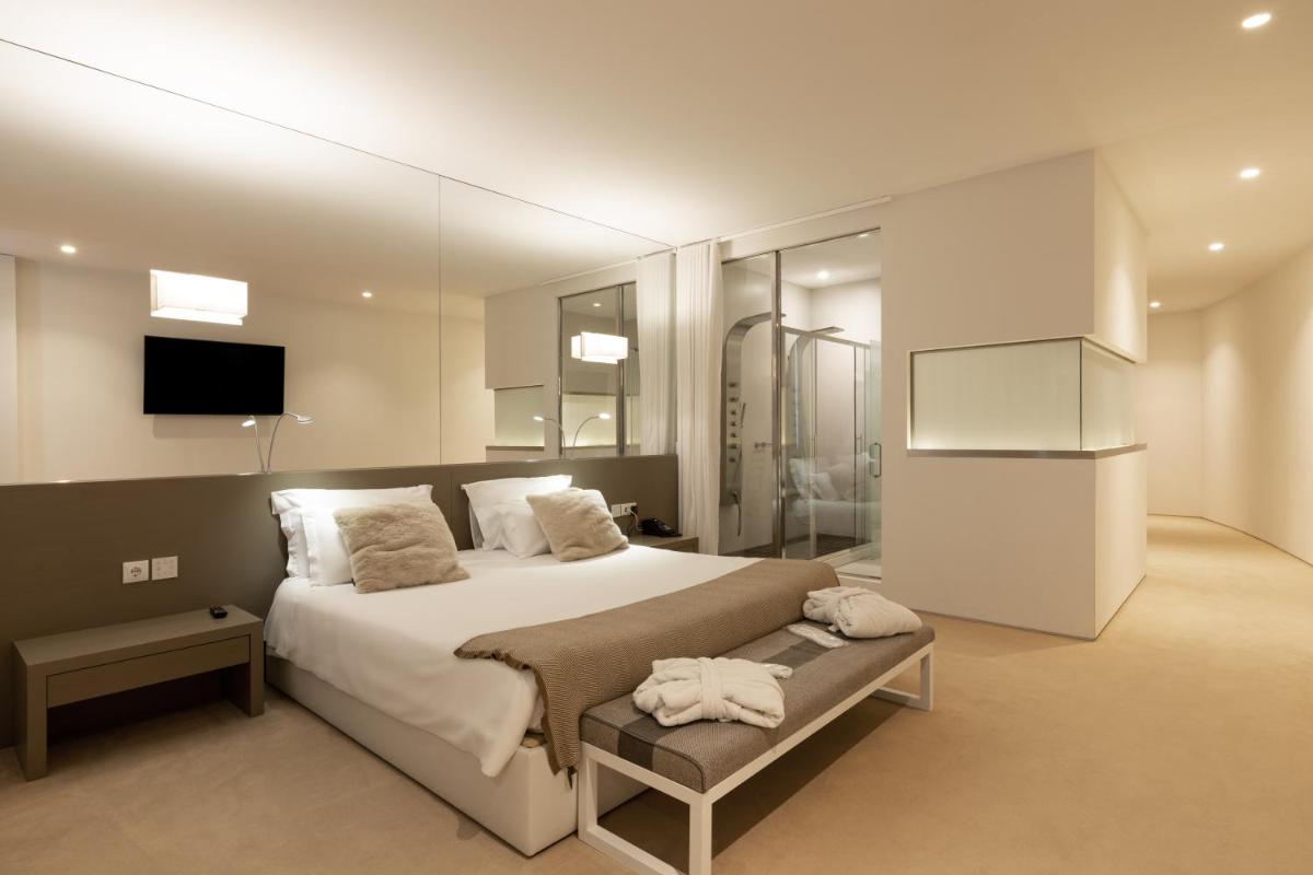 Uma cama ou camas num quarto em Tempus Hotel & Spa