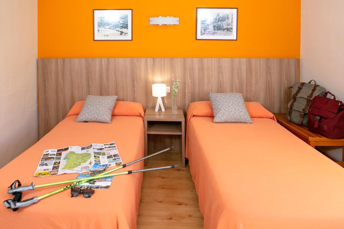 Cama o camas de una habitación en Hotel Snö Condes del Pallars