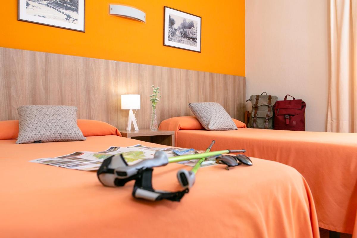 Cama o camas de una habitación en Hotel Snö Condes del Pallars
