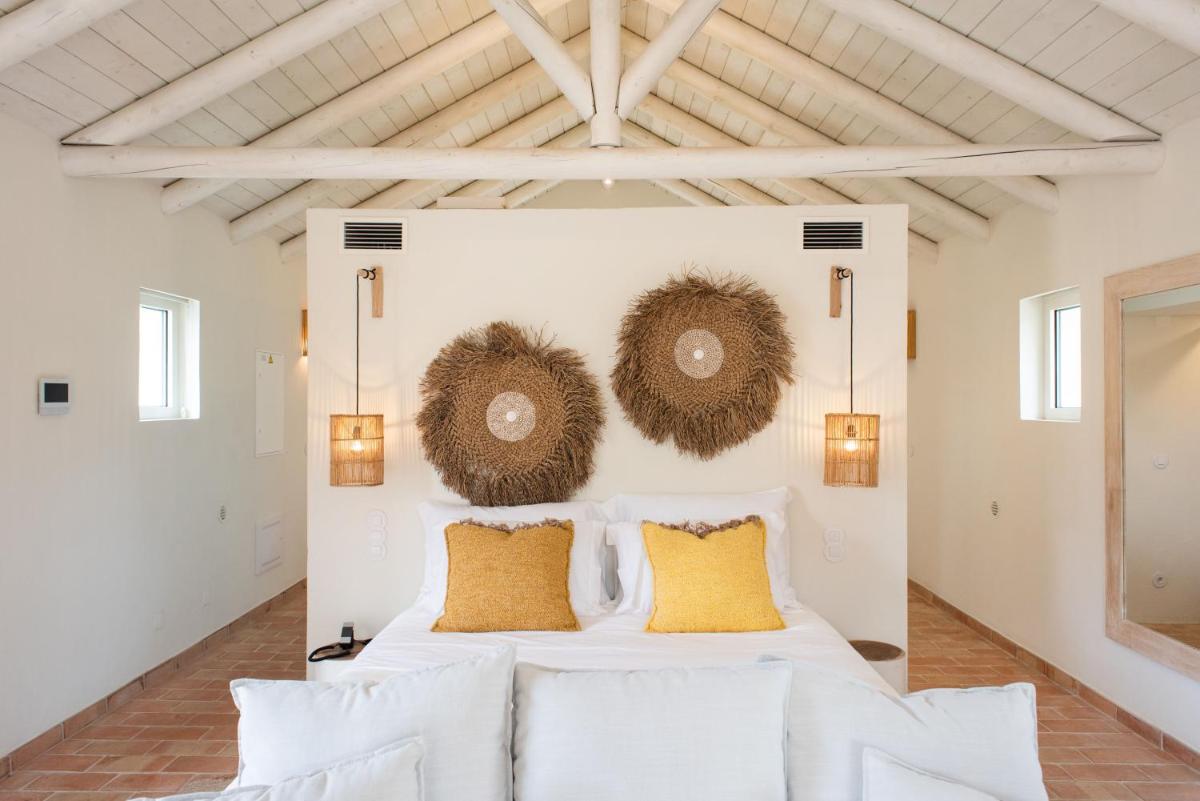 Uma cama ou camas num quarto em Independente Comporta