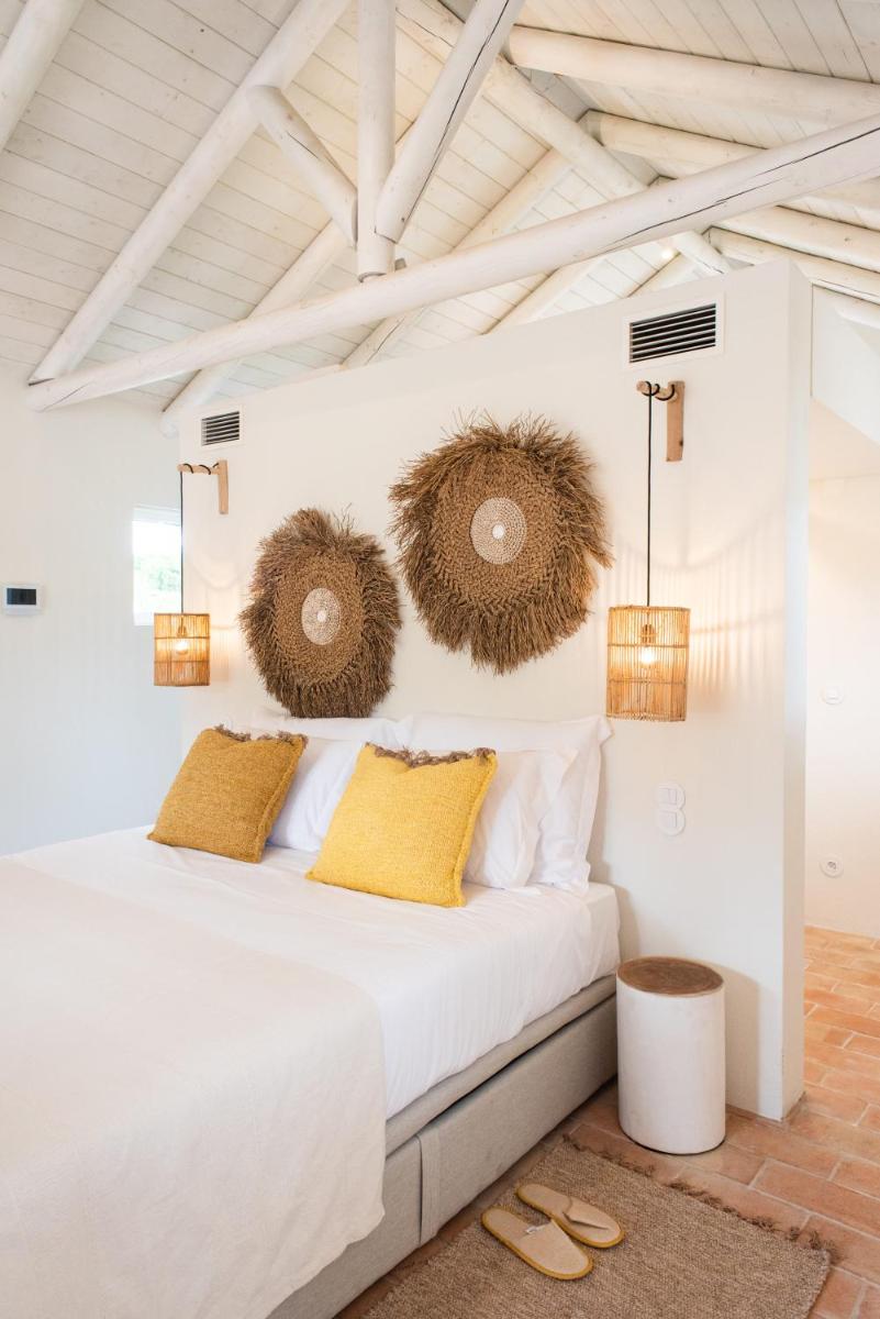 Uma cama ou camas num quarto em Independente Comporta