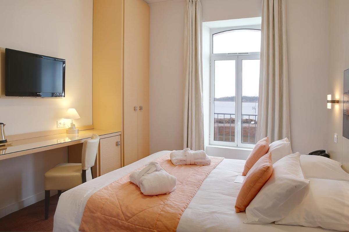 Un ou plusieurs lits dans un hébergement de l'établissement Best Western Plus Les Terrasses de Bréhat