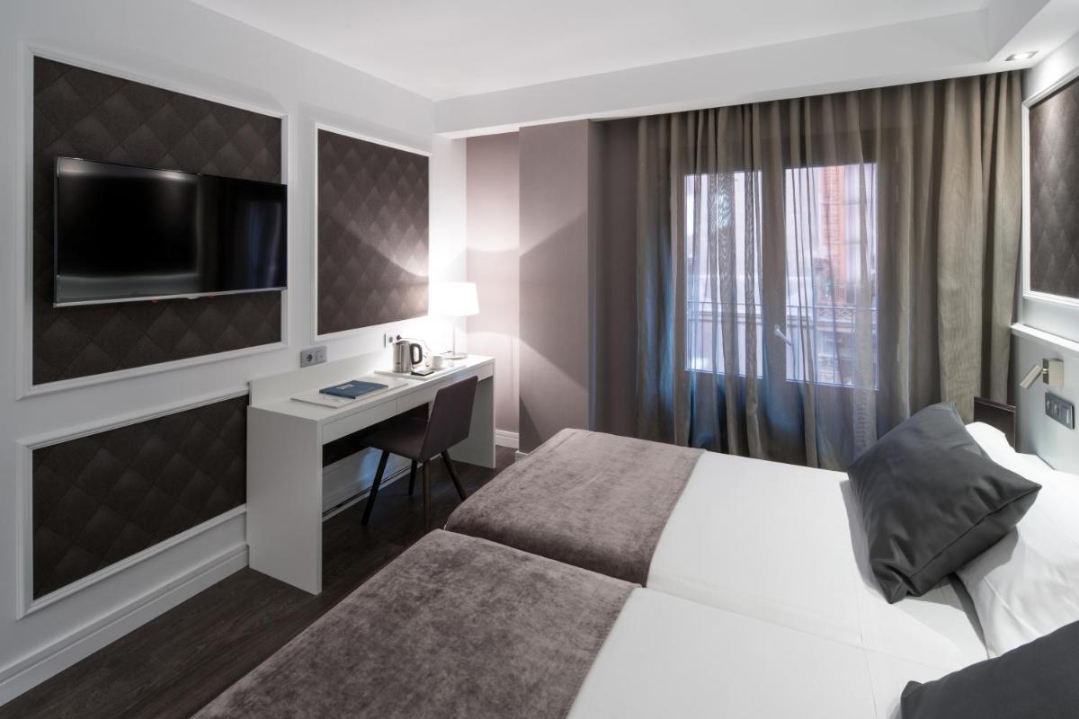 Cama o camas de una habitación en Catalonia Magdalenes