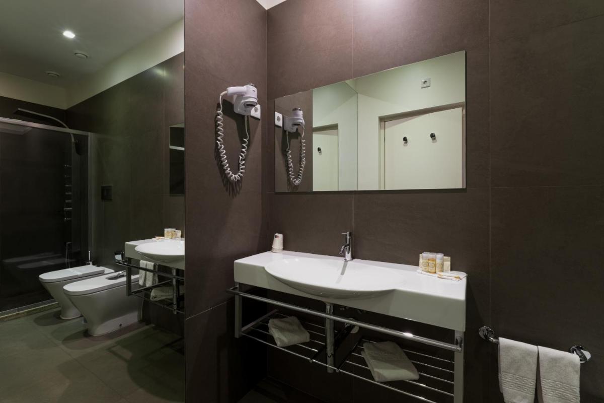 Uma casa de banho em Tempus Hotel & Spa