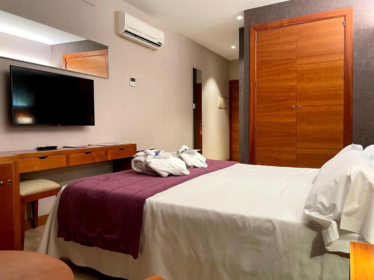 Cama o camas de una habitación en Hotel Balneario Valle del Jerte
