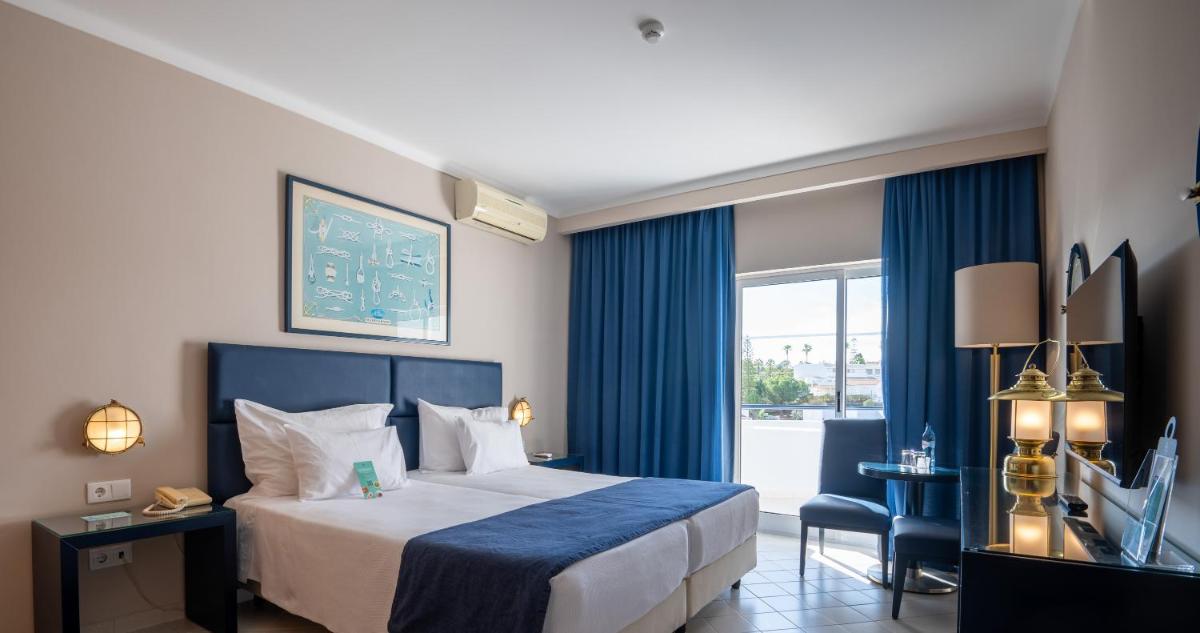 Uma cama ou camas num quarto em Vila Gale Nautico