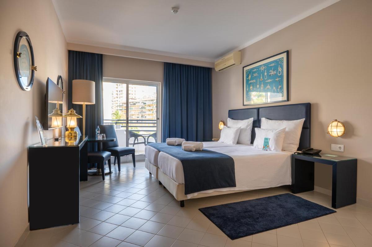 Uma cama ou camas num quarto em Vila Gale Nautico