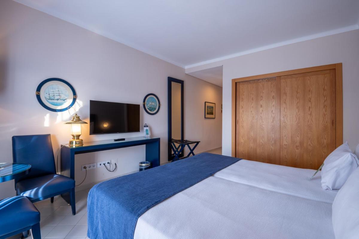 Uma cama ou camas num quarto em Vila Gale Nautico