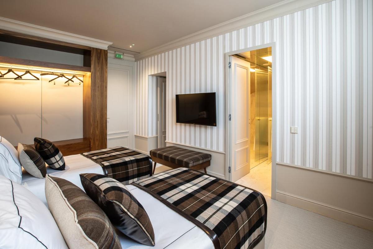 Uma cama ou camas num quarto em Vinha Boutique Hotel - The Leading Hotels of the World