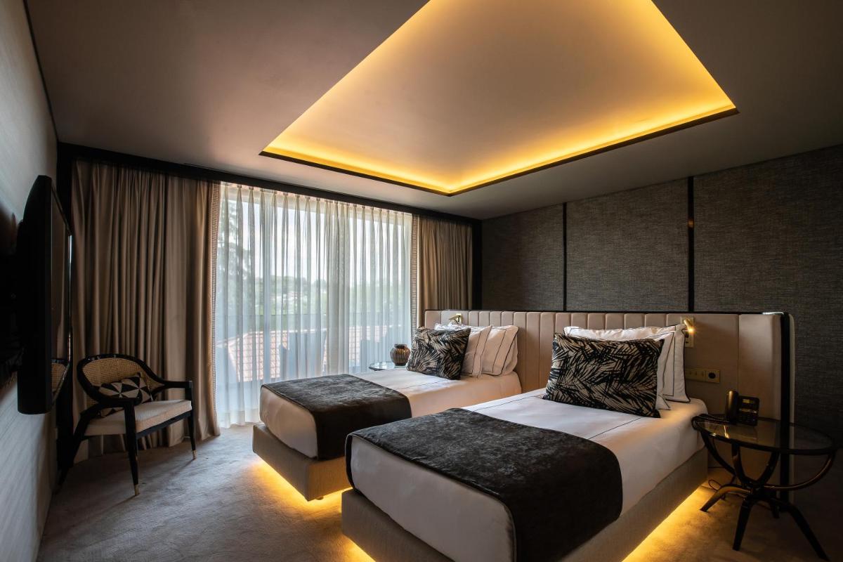 Uma cama ou camas num quarto em Vinha Boutique Hotel - The Leading Hotels of the World