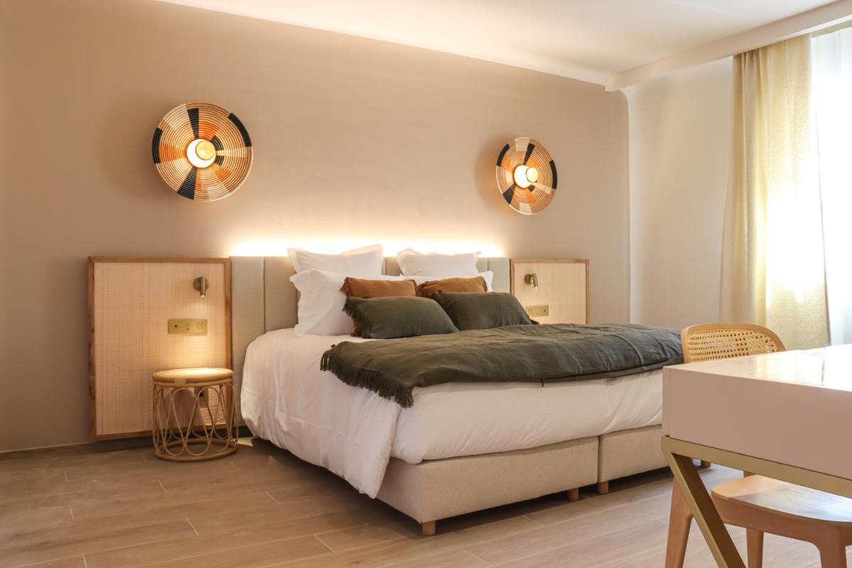 Un ou plusieurs lits dans un hébergement de l'établissement Hotel Riva Beach
