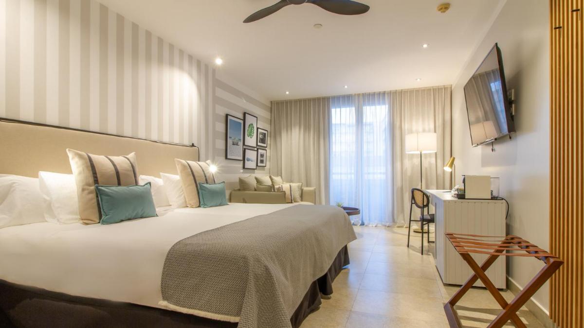 Cama o camas de una habitación en SOLYMAR Gran Hotel