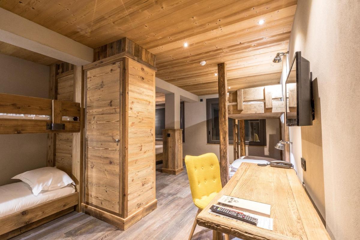 Un ou plusieurs lits dans un hébergement de l'établissement La Maison Rouge