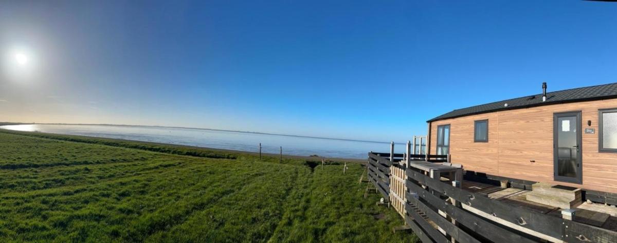 Traumlage Nr 59 5 Meter direkt am Wattenmeer erste Reihe Luxus Chalet unendliche Weite, eingebettet in der Natur - Housity