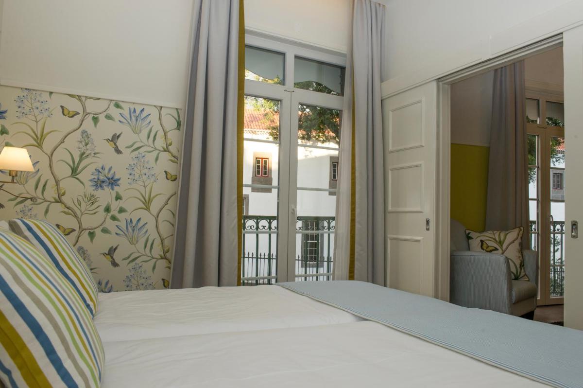 Uma cama ou camas num quarto em Castanheiro Boutique Hotel