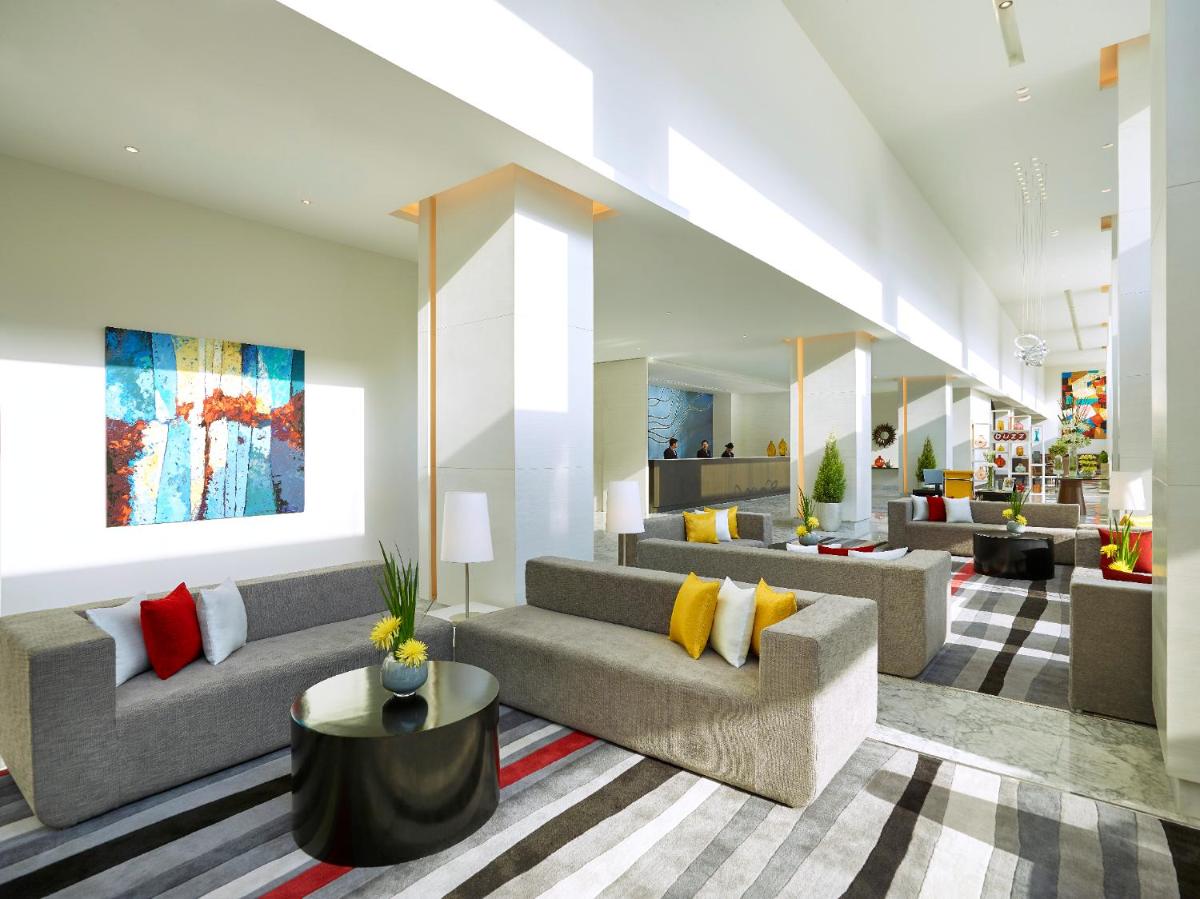 a living room with couches and a lobby at Vivanta Pune, Hinjawadi in Pune