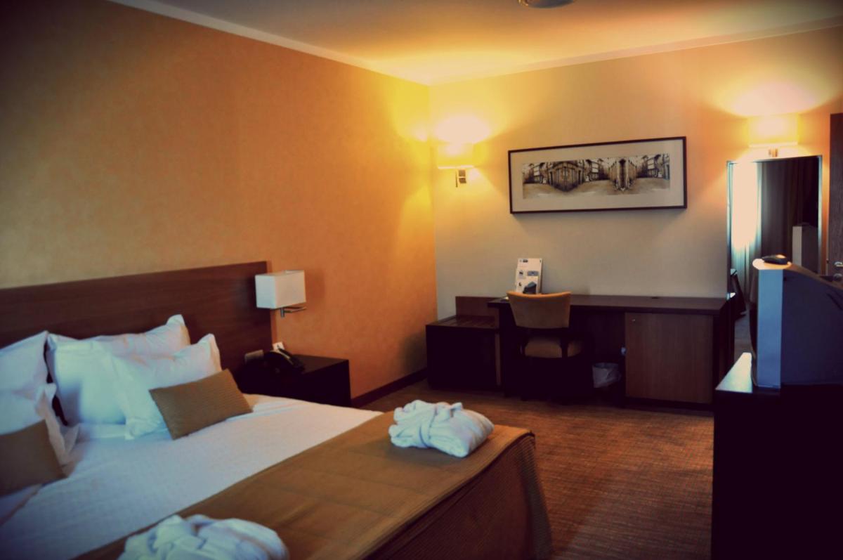 Uma cama ou camas num quarto em Hotel Lusitania Congress & Spa