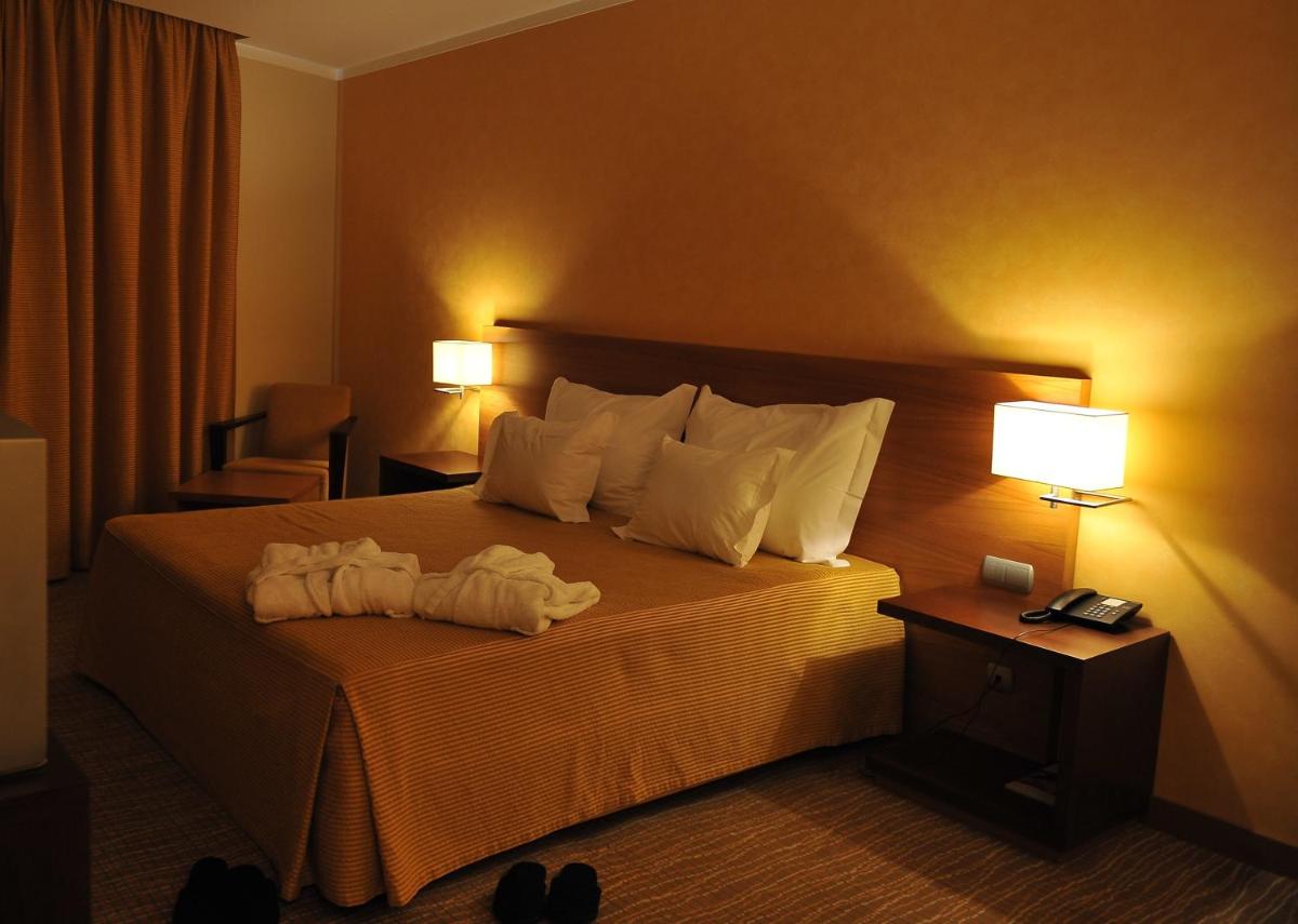 Uma cama ou camas num quarto em Hotel Lusitania Congress & Spa