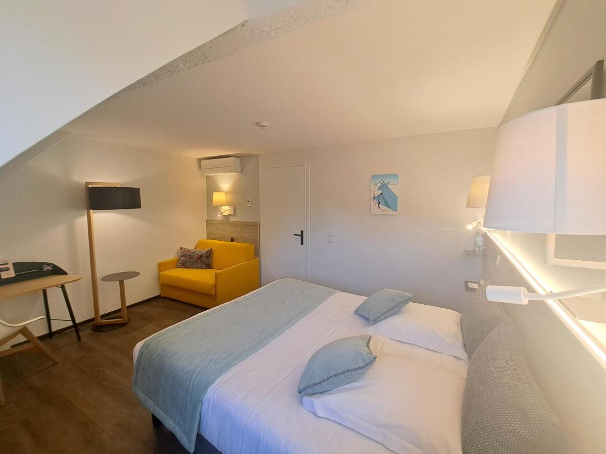 Un ou plusieurs lits dans un hébergement de l'établissement Hôtel des Princes, Chambéry Centre