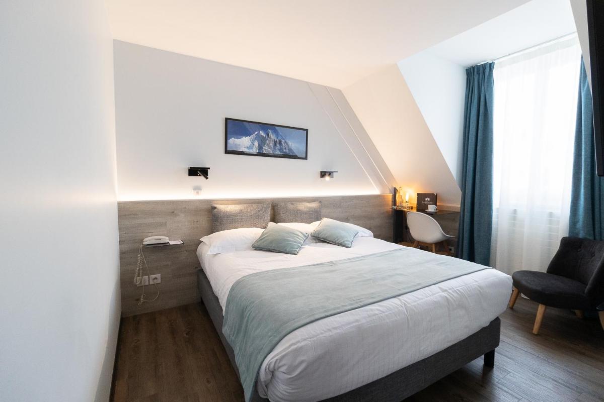 Un ou plusieurs lits dans un hébergement de l'établissement Hôtel des Princes, Chambéry Centre