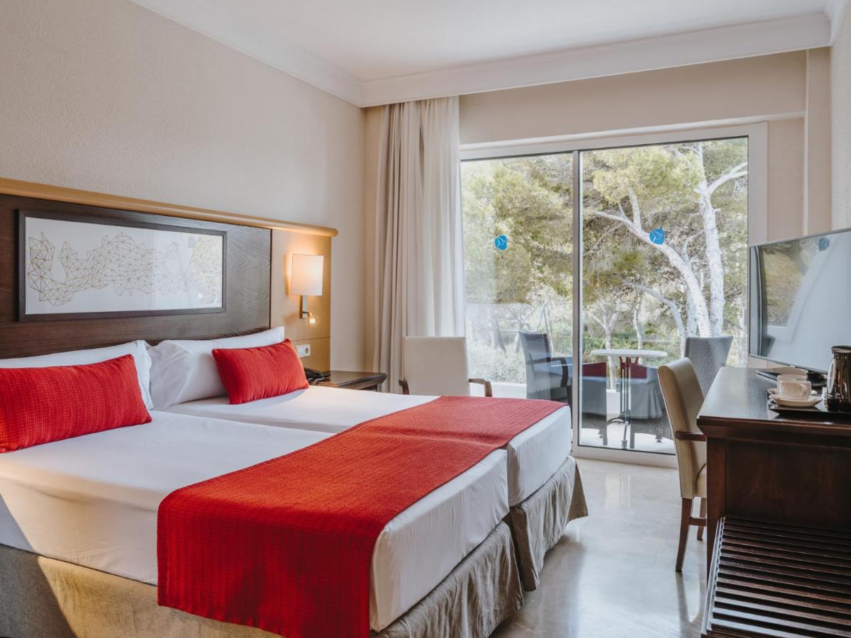 Cama o camas de una habitación en Grupotel Aguait Resort & Spa - Adults Only