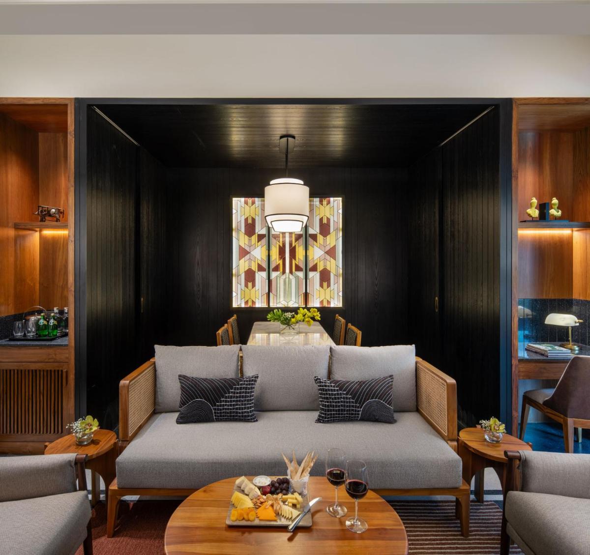 a living room with a couch and a table at Taj Taal Kutir in Kolkata