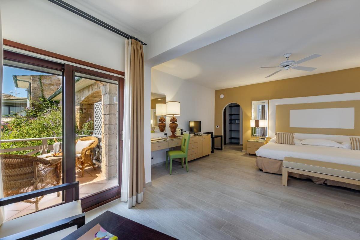 Un ou plusieurs lits dans un hébergement de l'établissement Hotel & SPA des Pecheurs