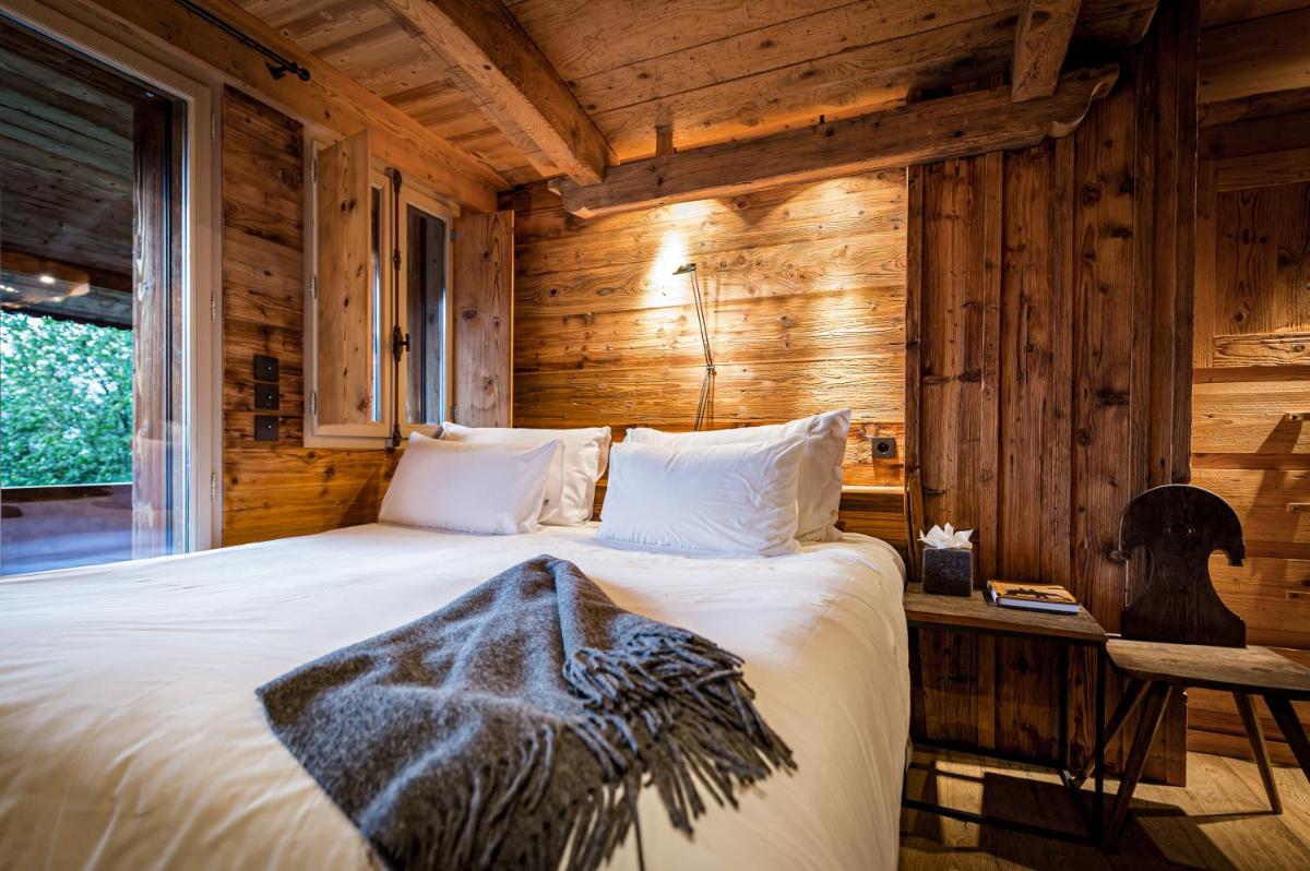 Un ou plusieurs lits dans un hébergement de l'établissement Zannier Le Chalet