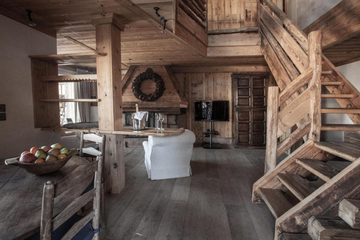 Télévision ou salle de divertissement dans l'établissement Zannier Le Chalet