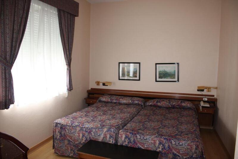 Cama o camas de una habitación en Hotel Las Sirenas