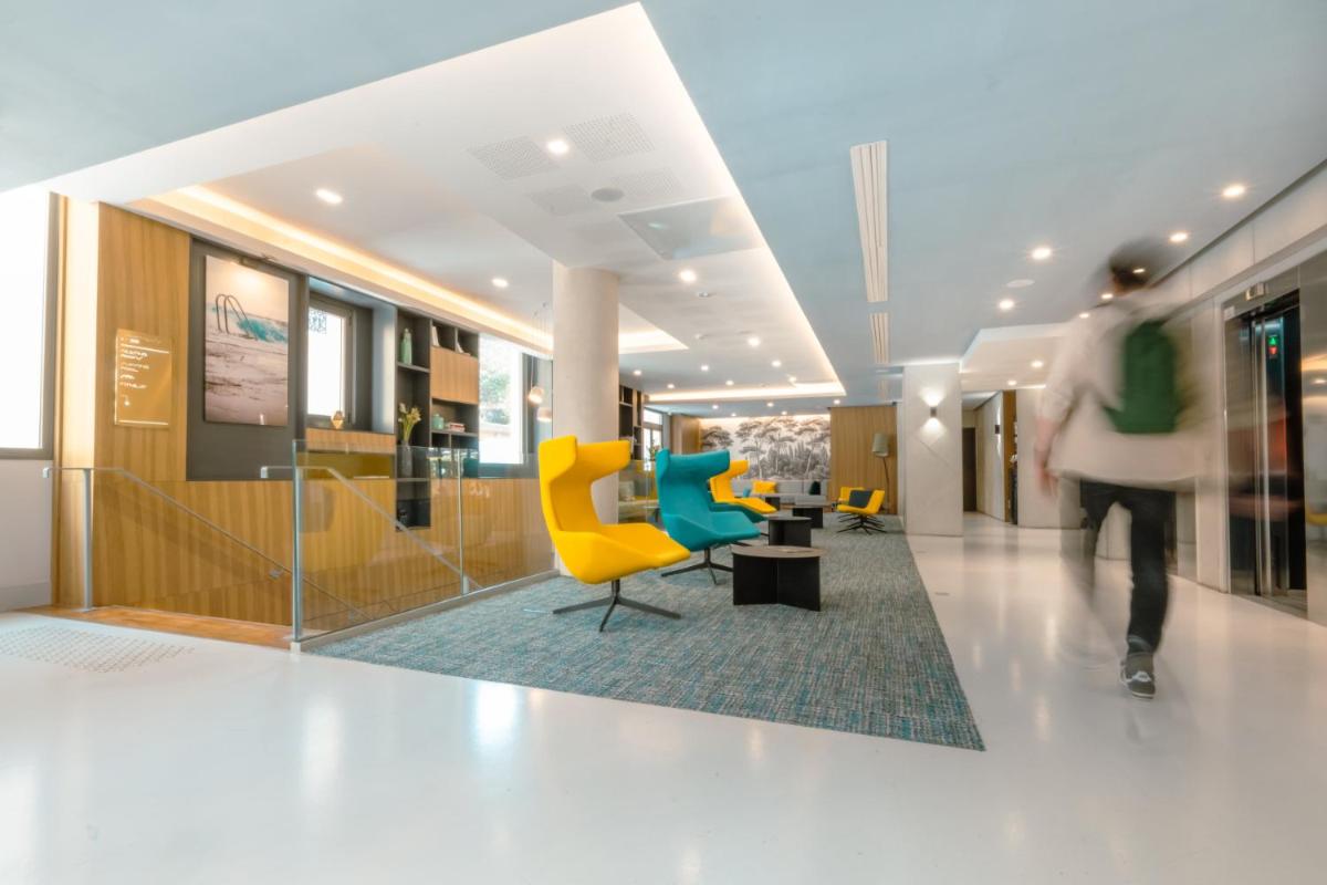 Coin salon dans l'établissement Nemea Appart Hotel Cannes Palais